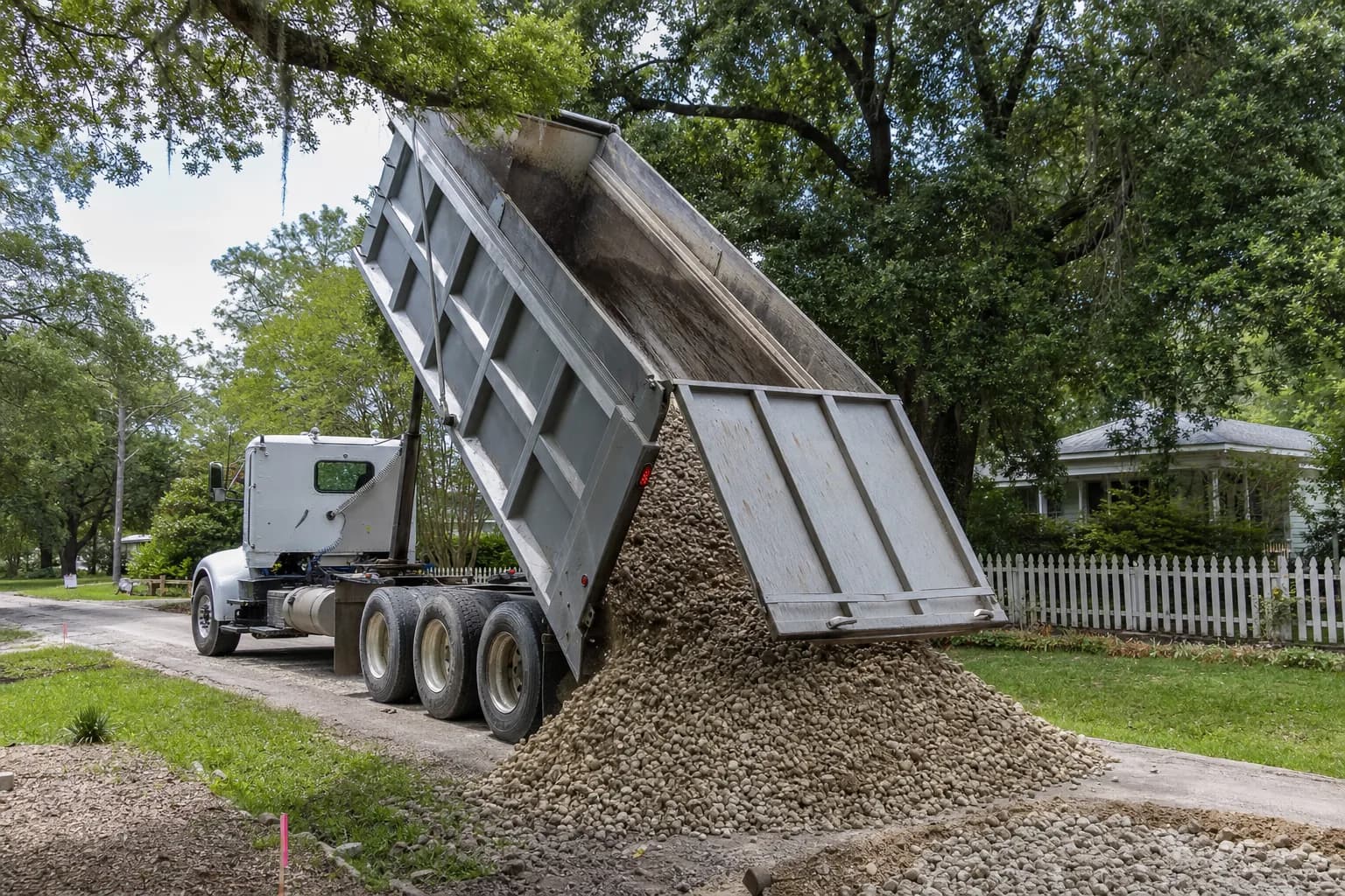 Dump truck delivering gravel